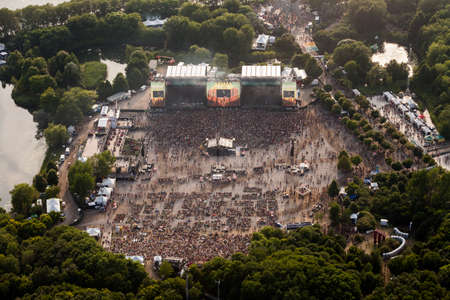 Montreal, August 8, 2014. Aerial view of the crowd enjoying various open air concerts at the main stage of the Osheaga arts & music summer festival on Ste-Helen Island.のeditorial素材