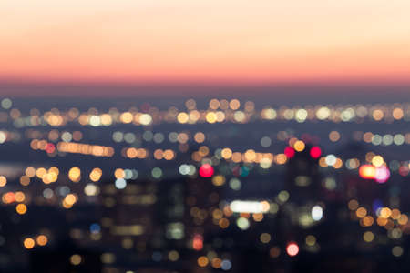 City night light blur bokeh at dawn , defocused background