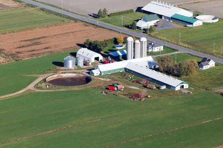Autum aerial view of a farm and fields at harvest season in rural Quebec, Canada.のeditorial素材