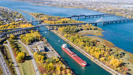 Montreal, October 20, 2016. Aerial view over the Ste-Lawrence seaway at the Mercier bridge linking Chatauguay to the Montreal island seen at fall. Canada.のeditorial素材