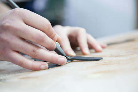 Adult Man Working In A Shoe Factory