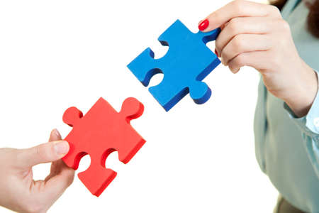 beautiful women  assembling jigsaw puzzle
