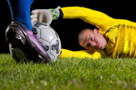 soccer ball with foot of player kicking itの写真素材