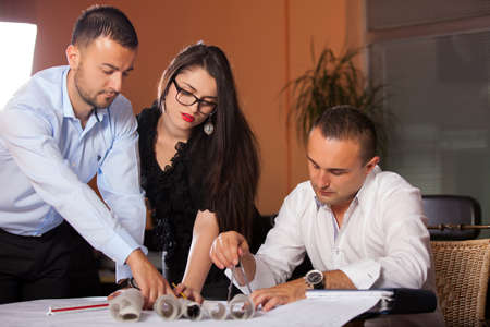 Team of architects working on construction plans