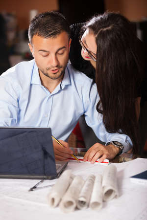 Team of architects working on construction plans