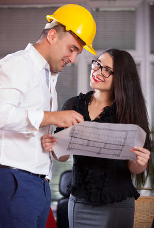 Team of architects working on construction plans