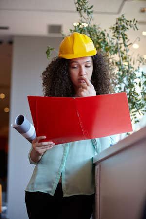 Young female architect in officeの写真素材