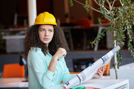 Young female architect in office