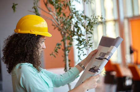 Young female architect in officeの写真素材