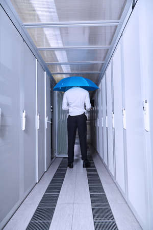 business man engeneer in modern datacenter server roomの写真素材