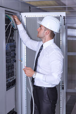 business man engeneer in modern datacenter server room