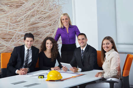 architects discussing business plans in office