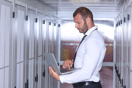 business man engeneer in modern datacenter server room