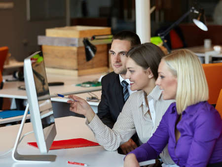 Group of happy young business people in a meeting