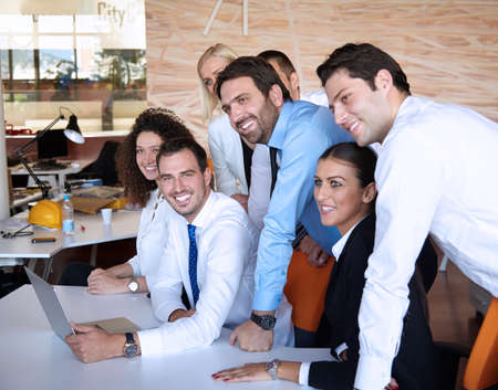 business partners discussing documents and ideas at meeting in office