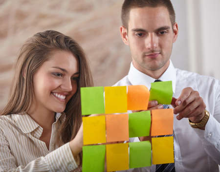 Businesswoman pointing on whiteboard in meeting with office