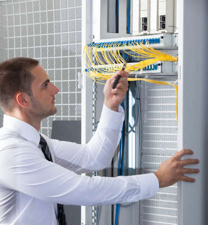 network engineer working in server room