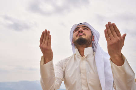 The iIslamic man praying   on the mountain.の写真素材