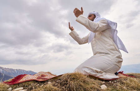 The iIslamic man praying   on the mountain.の写真素材