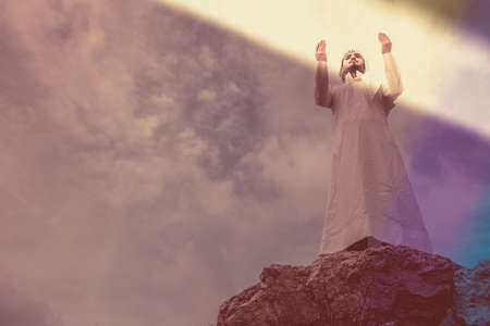 The iIslamic man praying   on the mountain.