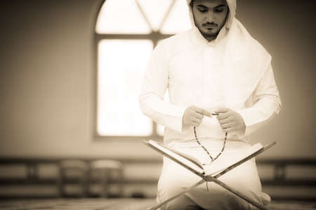 Religious muslim man praying inside the mosqueの写真素材