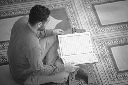 Religious muslim man praying inside the mosque