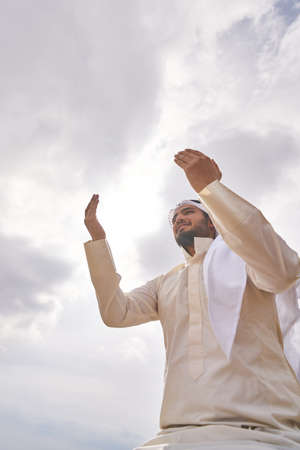 The iIslamic man praying   on the mountain.の写真素材