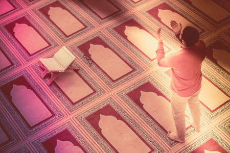 Religious muslim man praying inside the mosqueの写真素材