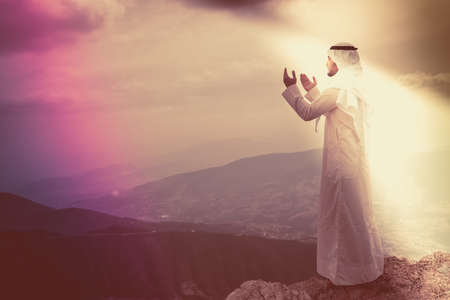 The iIslamic man praying   on the mountain.の写真素材