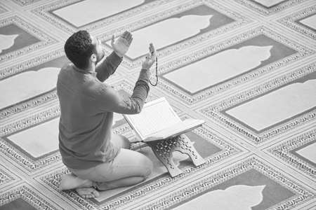 Religious muslim man praying inside the mosqueの写真素材