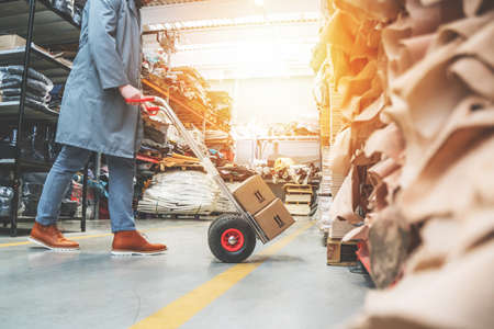 Working at leather warehouse at shoe factory used warehouse equipment. managerのeditorial素材