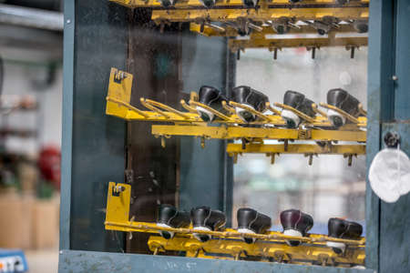 Various moulds used in shoe production line. shoe factoryの写真素材