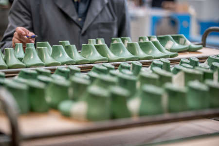 Various moulds used in shoe production line. shoe factoryの写真素材
