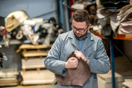 business manager at leather shoe factory doing various daily tasks. bossの写真素材