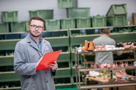 manager at a leather shoe manufacturing factory. inventoryの写真素材