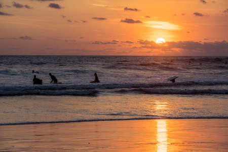 Surfing the waves of Indonesia beach. vacation conceptの写真素材