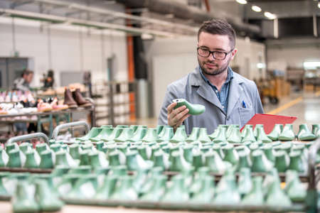manager at a leather shoe manufacturing factory. inventoryの写真素材