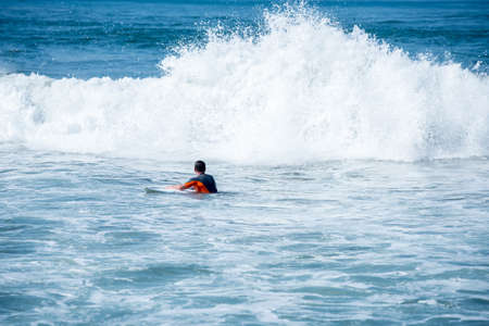 Surfing the waves of Indonesia beach. vacation conceptの写真素材