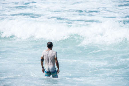 Surfing the waves of Indonesia beach. vacation conceptの写真素材