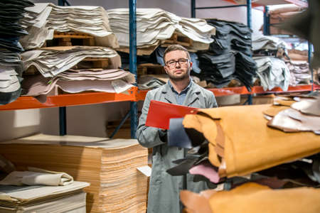 business manager at leather shoe factory doing various daily tasks. bossの写真素材