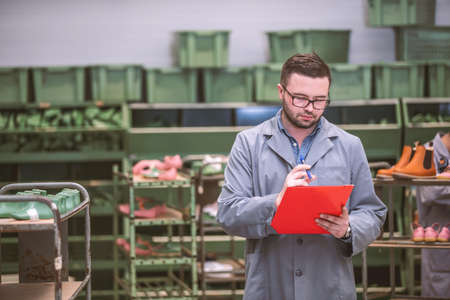 manager at a leather shoe manufacturing factory. inventoryの写真素材