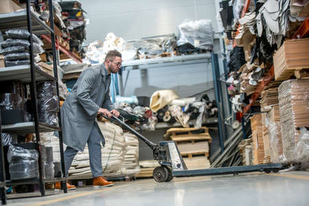 Working at leather warehouse at shoe factory used warehouse equipment. managerの写真素材