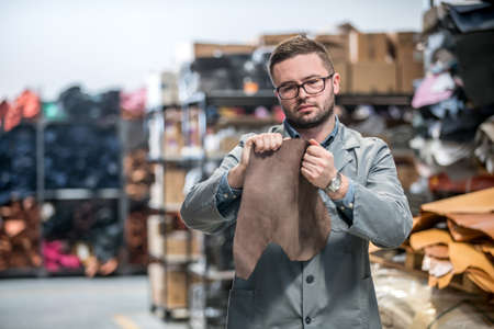 business manager at leather shoe factory doing various daily tasks. bossの写真素材