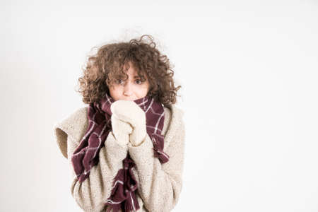Hispter girl posing in a studio. gray background