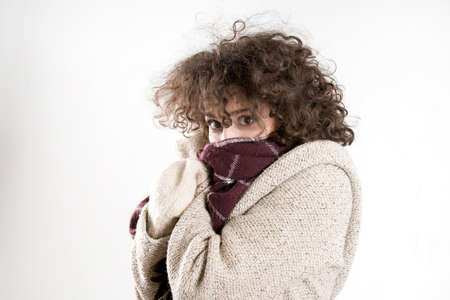Hispter girl posing in a studio. gray backgroundの写真素材