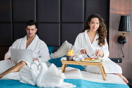 Breakfast in bed, cozy hotel room. conceptの写真素材