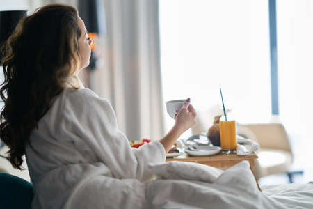 Breakfast in bed, cozy hotel room. conceptの写真素材