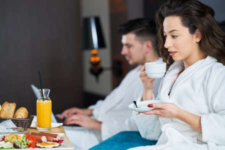 Breakfast in bed, cozy hotel room. conceptの写真素材