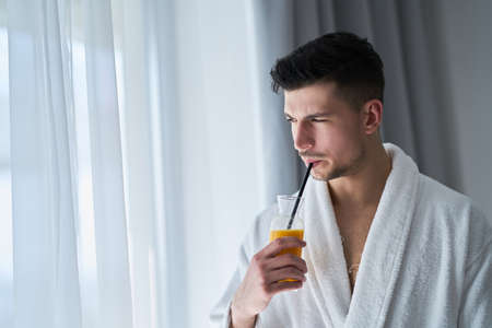guy at a hotel room relaxingの写真素材