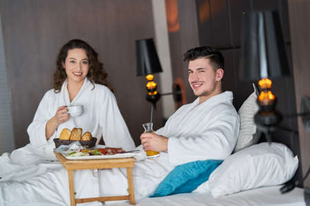 Breakfast in bed, cozy hotel room. conceptの写真素材